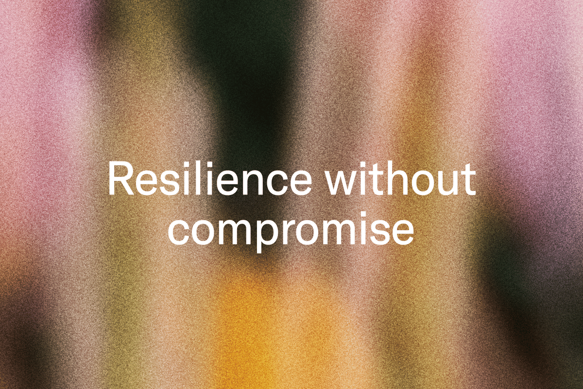 White text "Resilience without compromise" on a blurry, grainy background with vertical streaks of pink, orange, and dark colors.